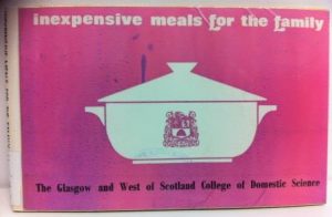 photograph of front cover of book entitled "inexpensive meals for the family" with graphic of a white casserole dish on a pink background